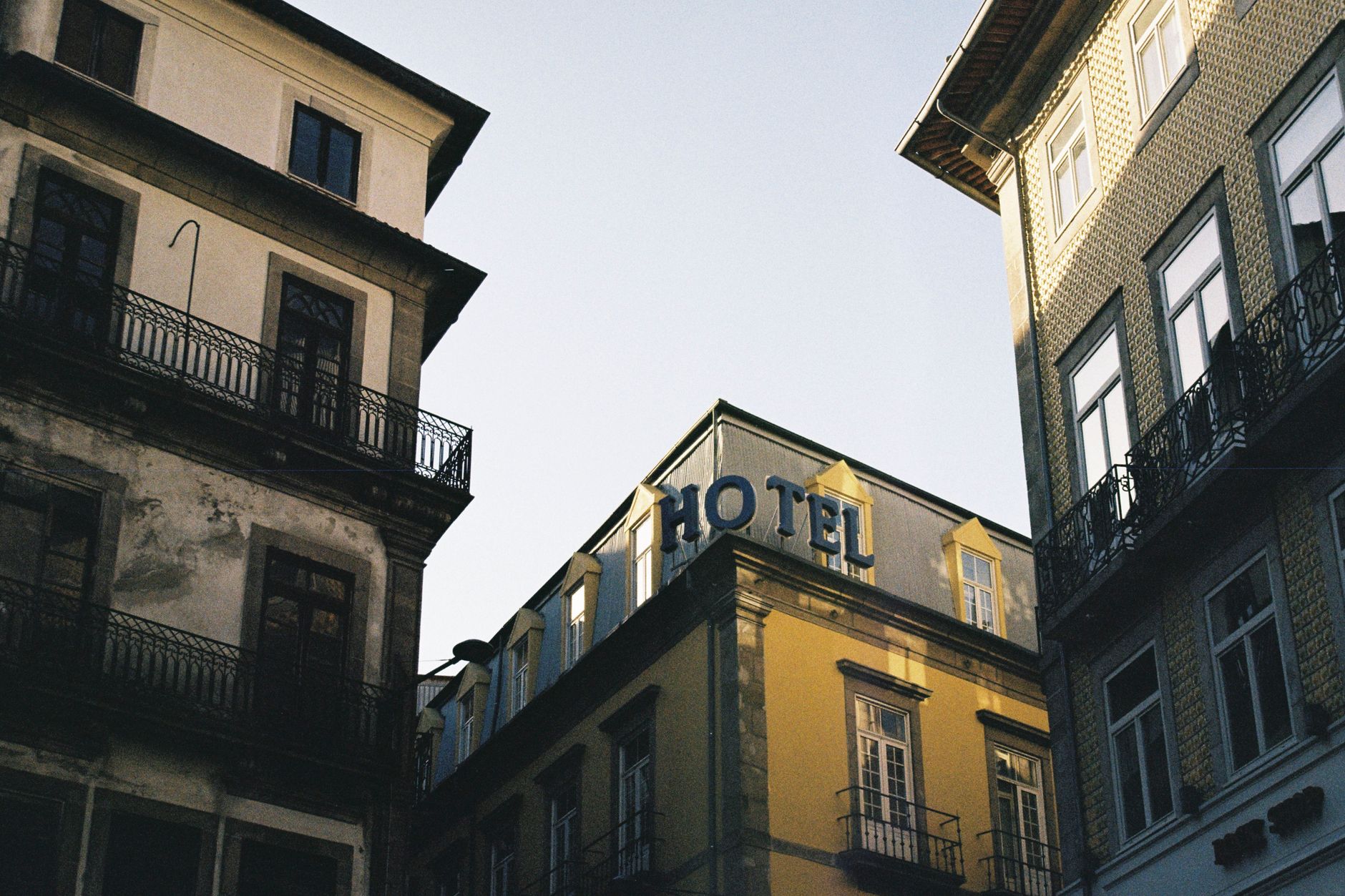 Charming hotel facade in Porto, Portugal, showcasing classic city architecture.