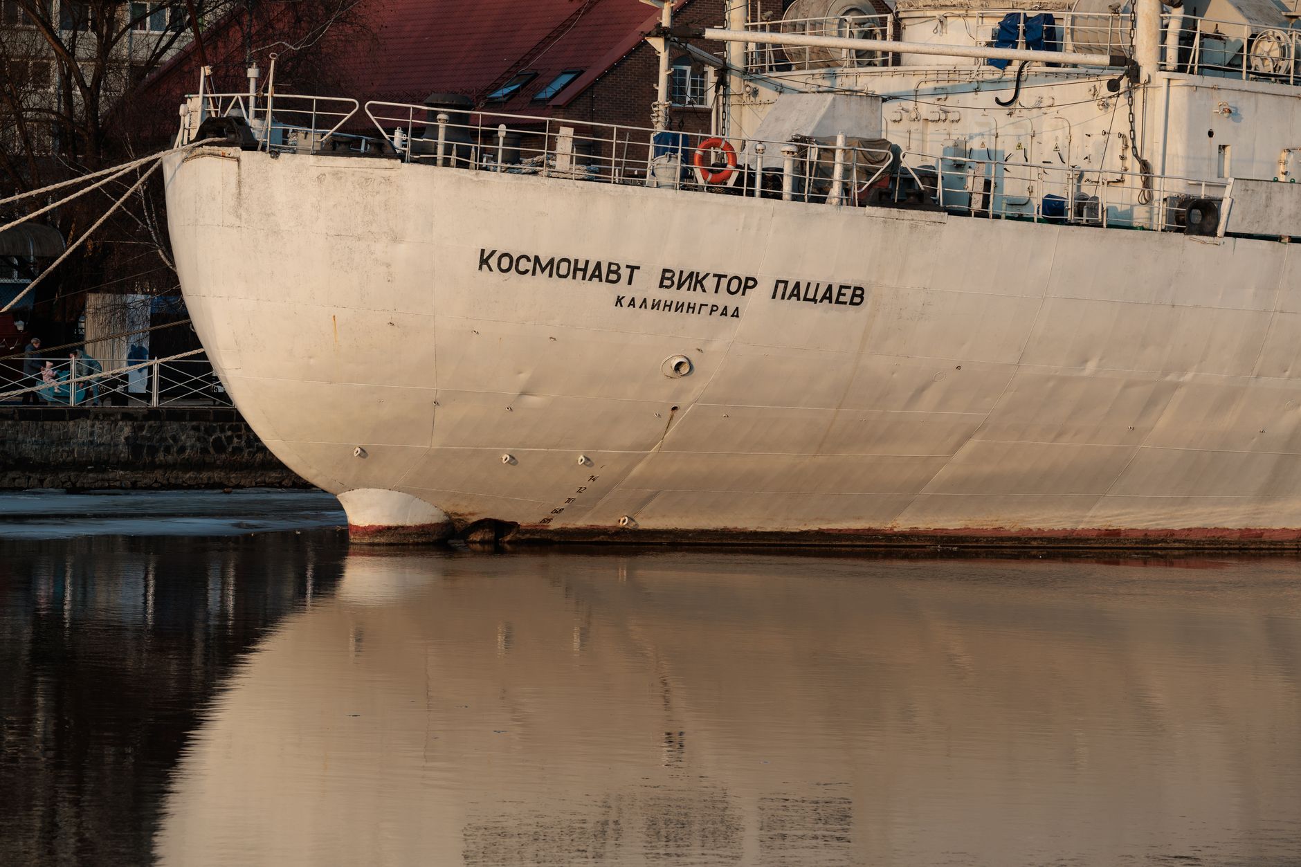 Cosmonaut Viktor Patsaev ship in Kaliningrad reflecting on water.