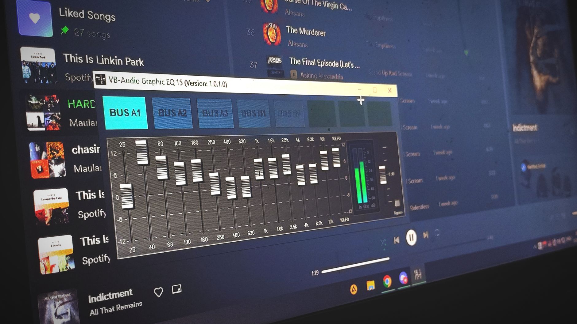 Close-up of a digital audio graphic equalizer on a laptop screen for music editing.